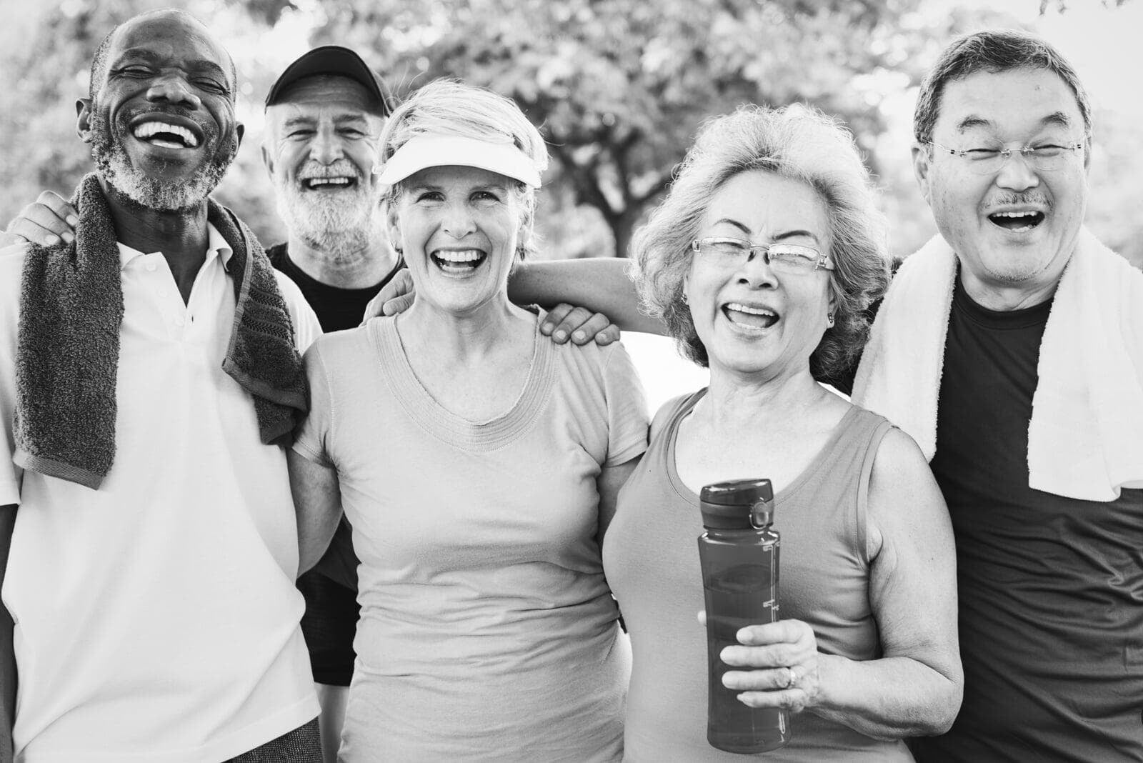 Group of diverse older friends exercising together