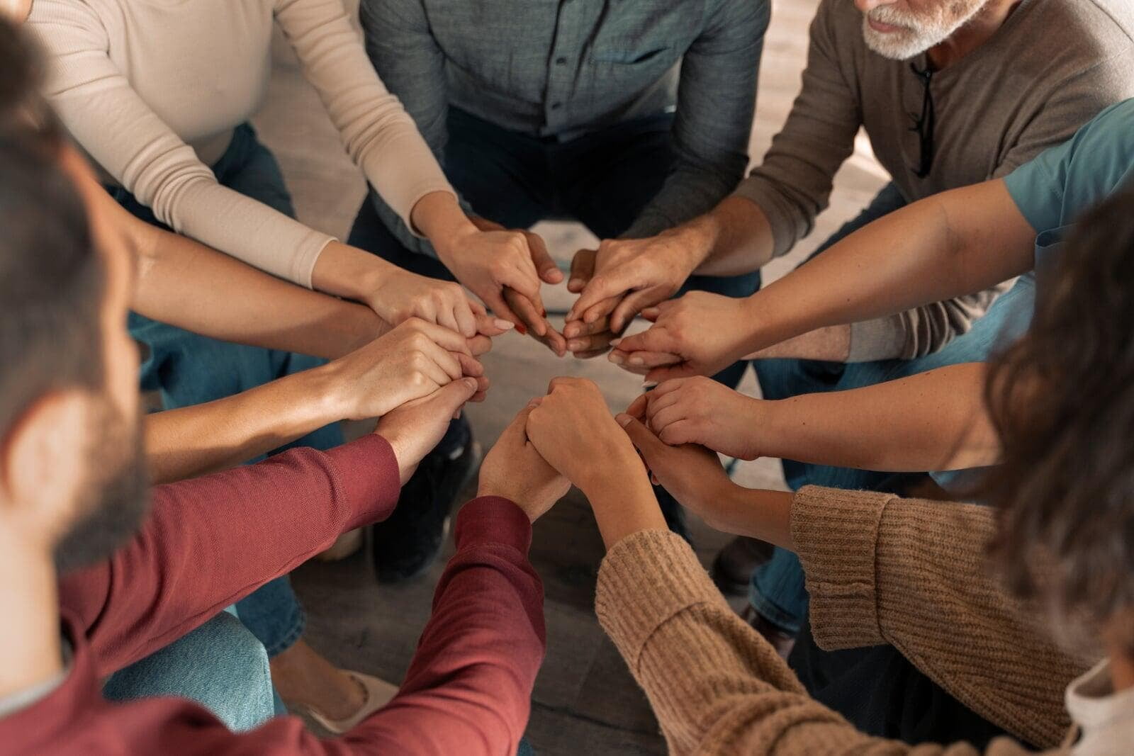 Hands in a circle together