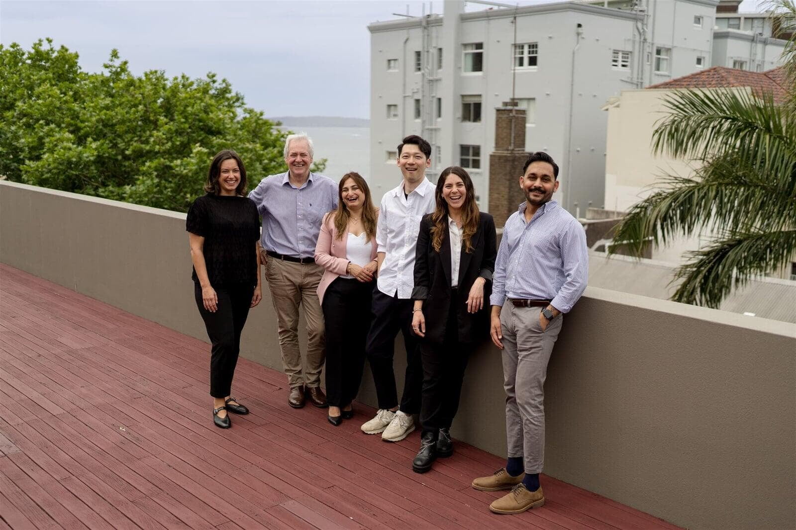 An image of the Reliant office team standing on our deck